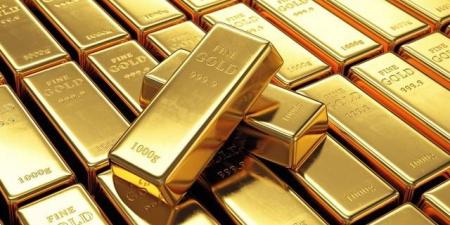 الذهب يتراجع مع صعود الدولار عقب بيانات قوية لنمو الاقتصاد الأمريكي